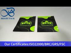 πράσινη και μαύρη πλαστική τσάντα